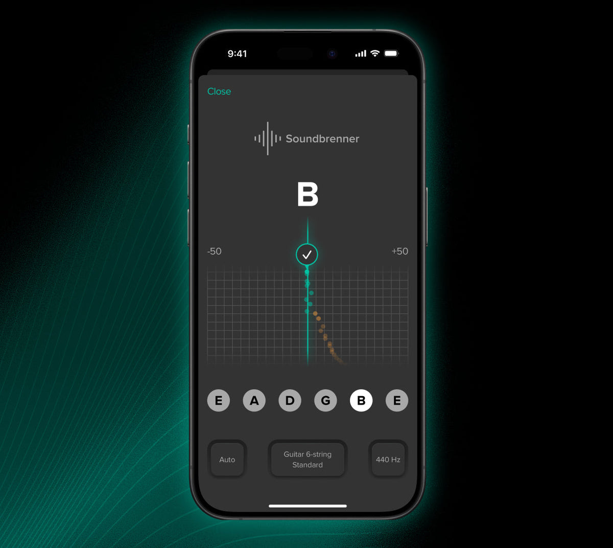 显示 Soundbrenner 应用的智能手机，屏幕上有 B 音符和音高图