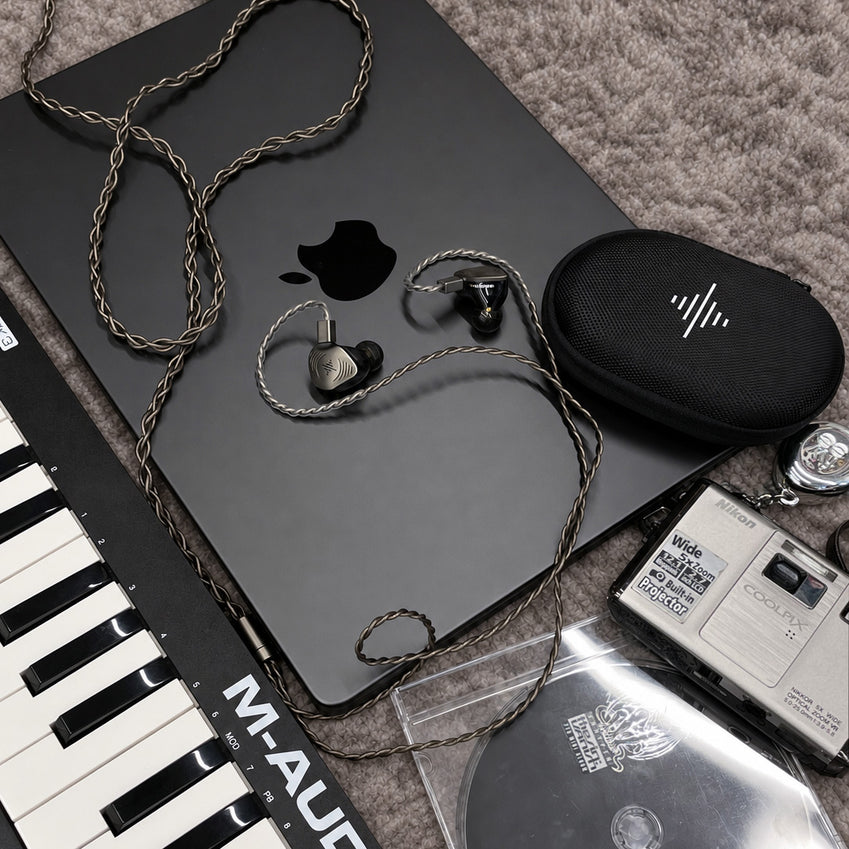 Wave Pro 2 beside a laptop and music keyboard