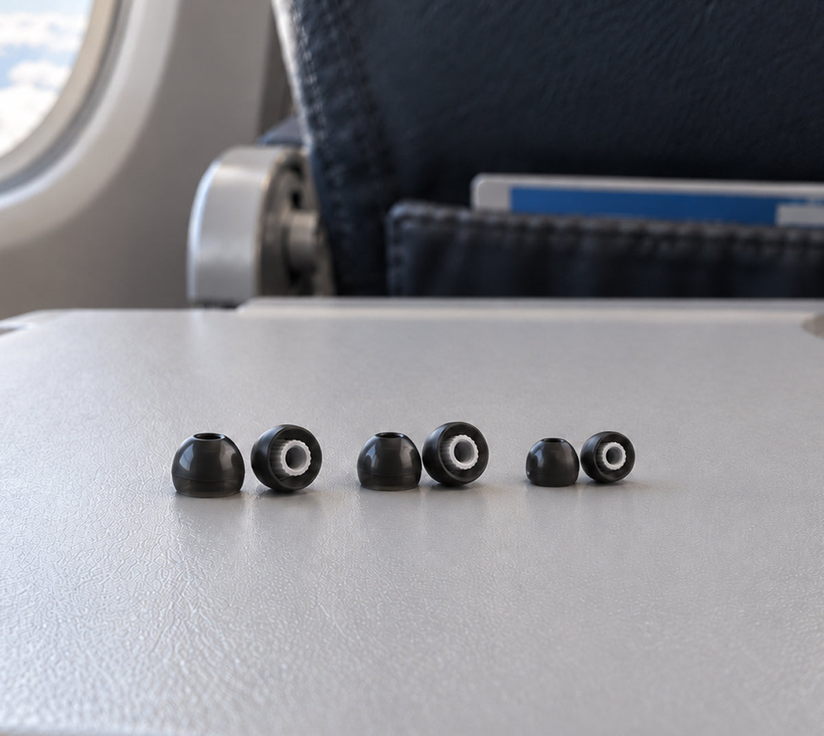 Wave Pro 2 ear tips arranged on an airplane tray table